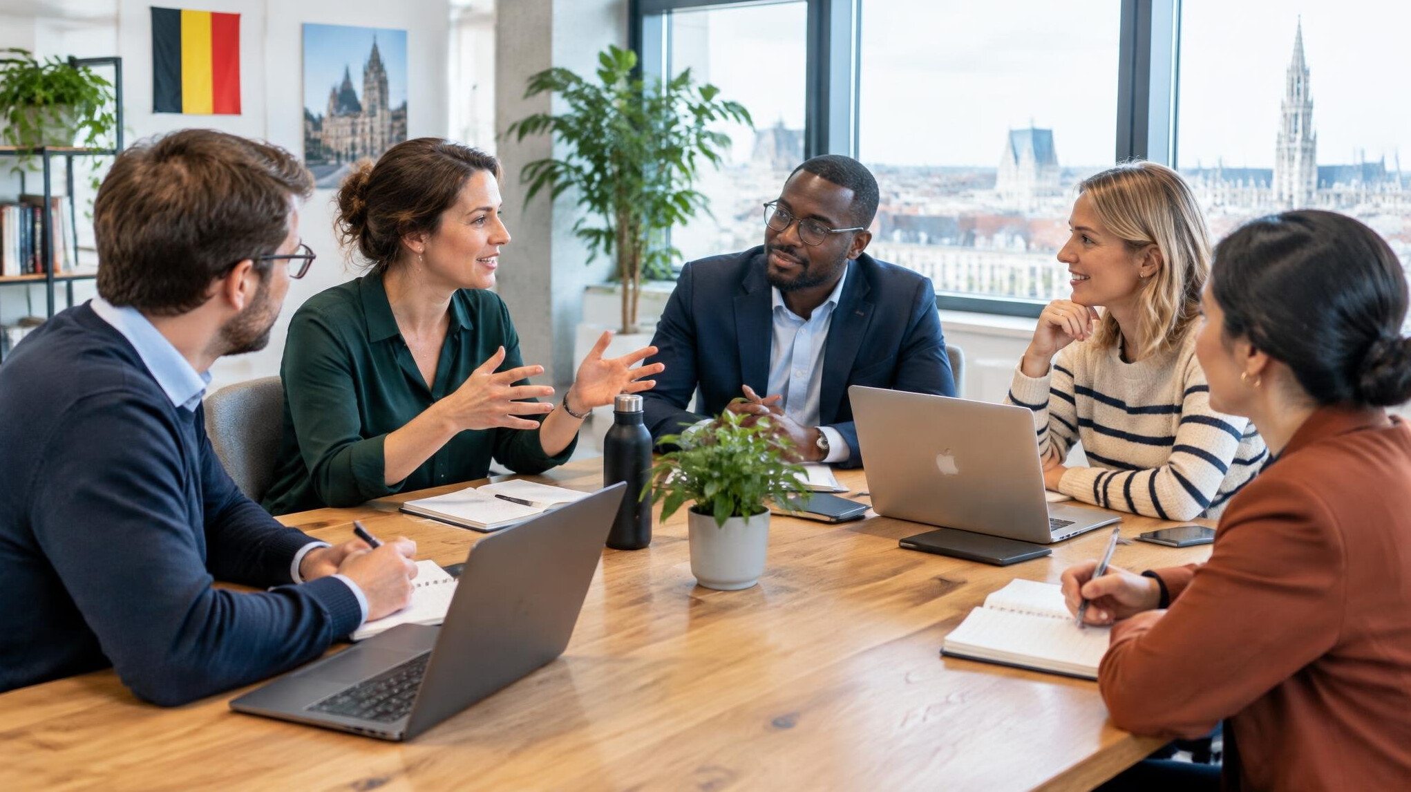 Team having a discussion around a table in a modern office